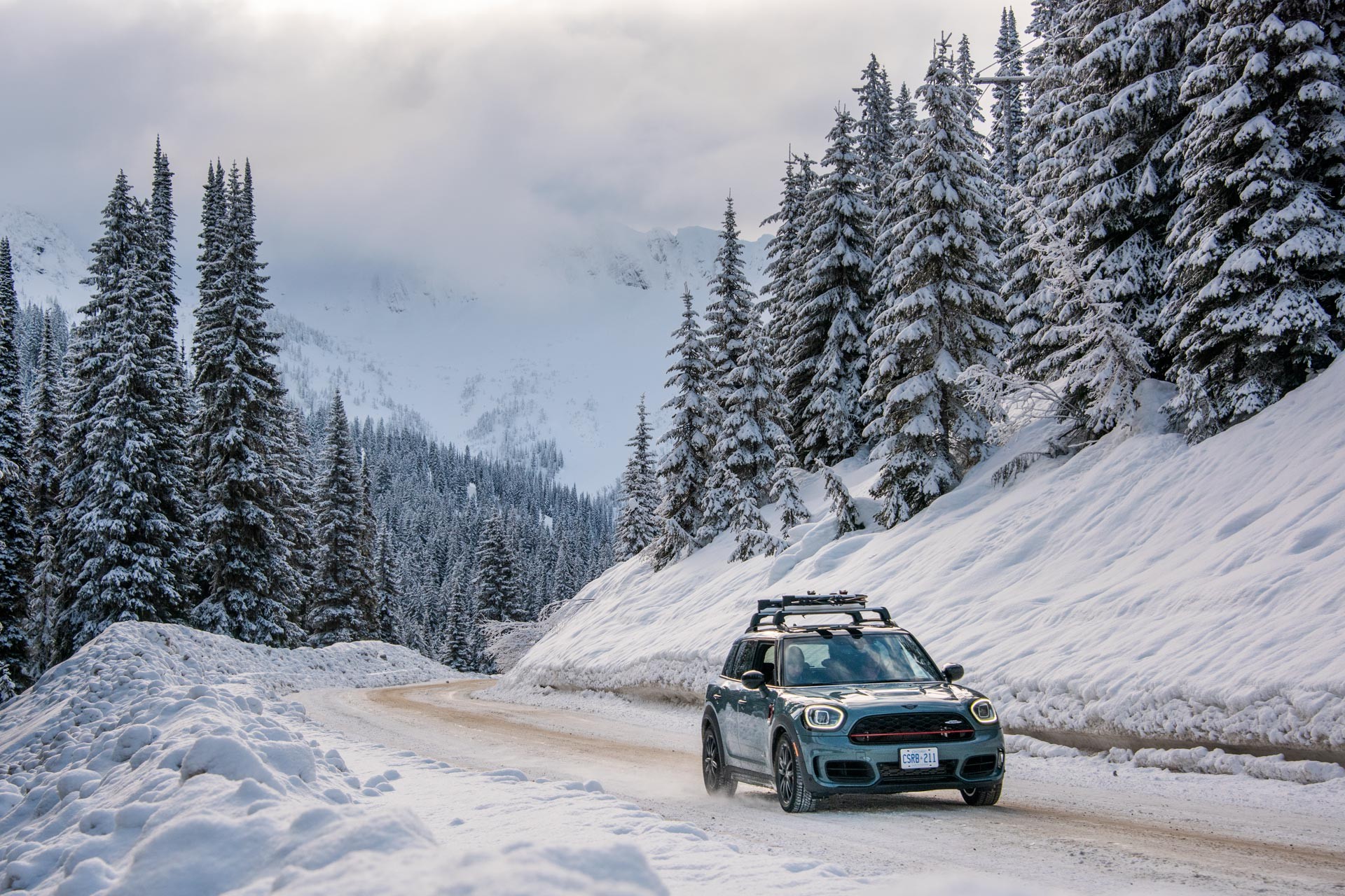 Image of the MINI Countryman, driving through the snowy landscape of British Columbia, Canada.